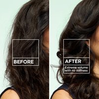 A side-by-side comparison of hair. The "BEFORE" side shows flatter, less defined waves, while the "AFTER" side shows "Extreme volume with no stiffness".