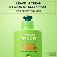 Close-up of a bottle of Garnier Fructis Sleek & Shine Leave-In Conditioner, with text that claims "Up to 3 days of sleek hair with system of Sleek & Shine Shampoo, Conditioner and Leave-in Cream. For frizzy, dry hair".