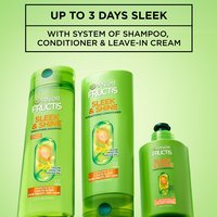 Three Garnier Fructis Sleek & Shine products (shampoo, smoothing conditioner, and leave-in conditioner) displayed, with text claiming "UP TO 3 DAYS SLEEK WITH SYSTEM OF SHAMPOO, CONDITIONER & LEAVE-IN CREAM."