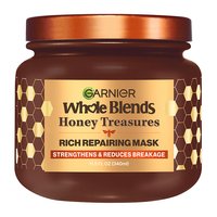 Garnier Whole Blends Honey Treasures Rich Repairing Mask hero shot: intensive hair treatment jar designed to repair the three main signs of damage: split ends, breakage, and dryness.