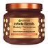 Garnier Whole Blends Honey Treasures Rich Repairing Mask hero shot: intensive hair treatment jar designed to repair the three main signs of damage: split ends, breakage, and dryness.