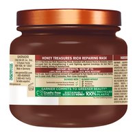 Back label of Garnier Whole Blends Honey Treasures Rich Repairing Mask: showing full ingredient list, directions, and 'Greener Beauty' commitments including sustainably sourced acacia honey and beeswax.