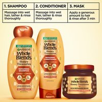 Complete 3-step Garnier Whole Blends Honey Treasures repairing system: featuring repairing shampoo, repairing conditioner, and rich repairing mask for a comprehensive damaged hair care routine.