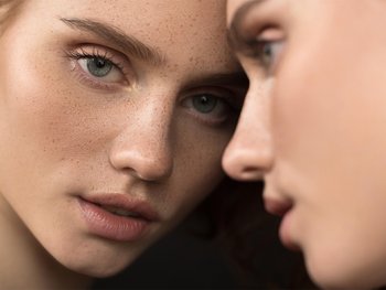 Woman staring into the camera.