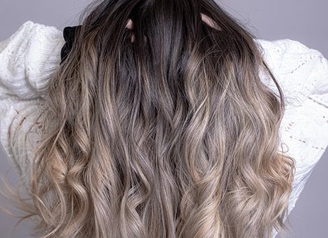 Foil highlighting and balayage highlighting hair color techniques