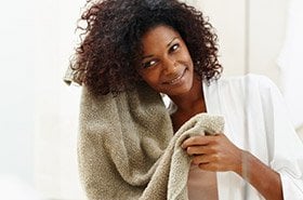 Garnier Fructis -  avoid common curly hair style and hair care mistakes - brushing, blow drying, towel-drying, over-cleansing will lead to unhealthy, frizzy curls