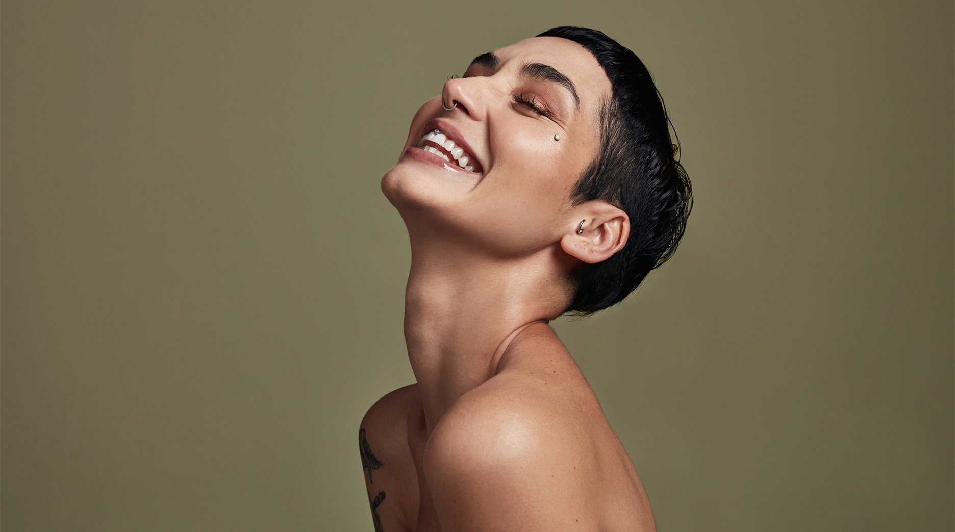 Model with dark hair, pixie cut