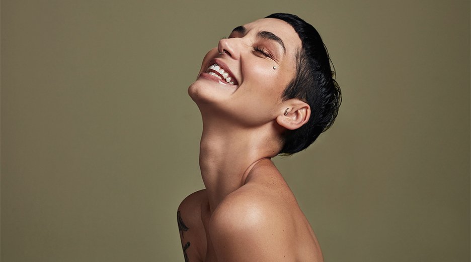 Model with dark hair, pixie cut