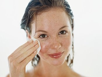 A person relaxing with a white, creamy face mask applied to their skin, highlighting a nourishing and rejuvenating skincare treatment or spa experience.