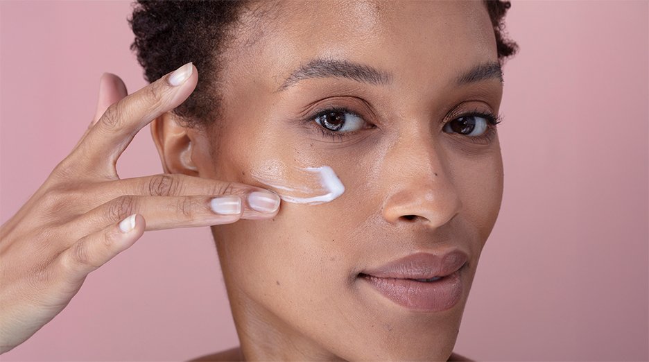 Woman washing her face with face wash.