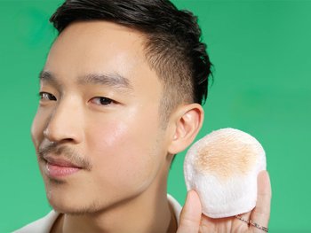 Male using Garnier Micellar Cleansing Water poured on a Micellar Cleansing Eco Pad