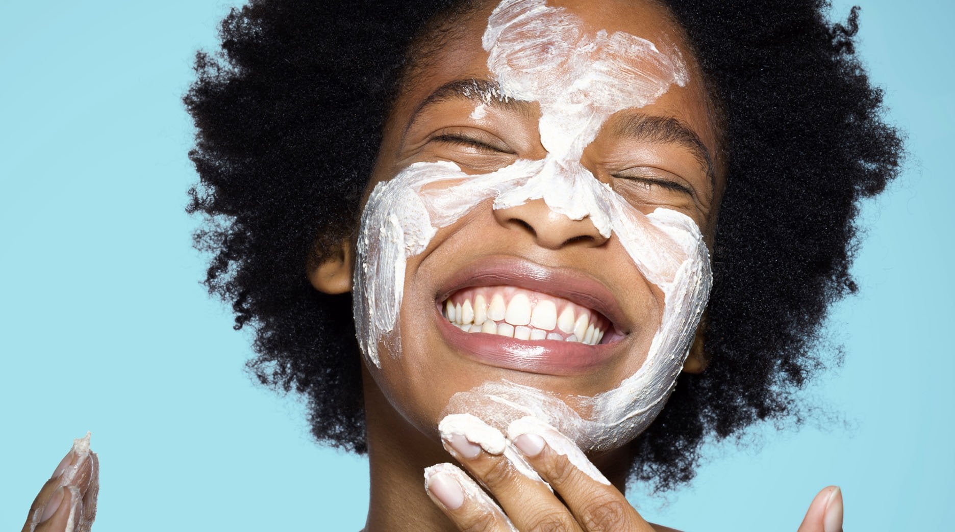 Women washing her face with a cleanser