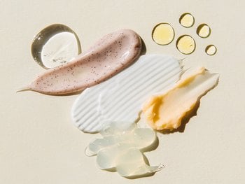 Various skincare products and ingredients arranged on a surface.