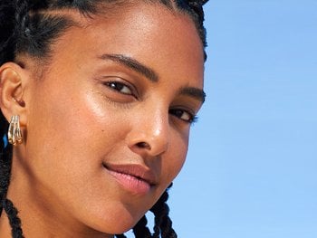 Close-up of a person's face with an uneven skin tone.
