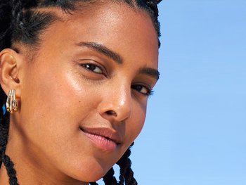 Close-up of a person's face with an uneven skin tone.