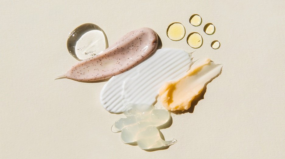 A collection of skincare products, including creams, serums, and oils.