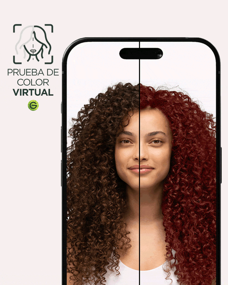 A woman with type 4 curly hair in a natural dark brown shade using Garnier's Virtual Try-On tool to virtually try on an auburn red hair shade.