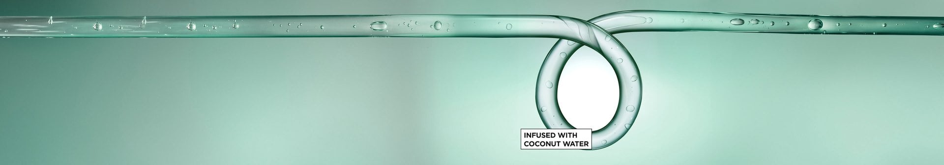 A translucent teal water droplet swirl illustration highlighting a Garnier Curl Styling products formula infused with coconut water.