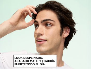 Garnier Fructis Style model showcasing a windblown look achieved with Surfer Hair Power Putty, next to on-image text reading "WINDBLOWN LOOK WITH MATTE FINISH & ALL-DAY STRONG HOLD," set against a mint green background.
