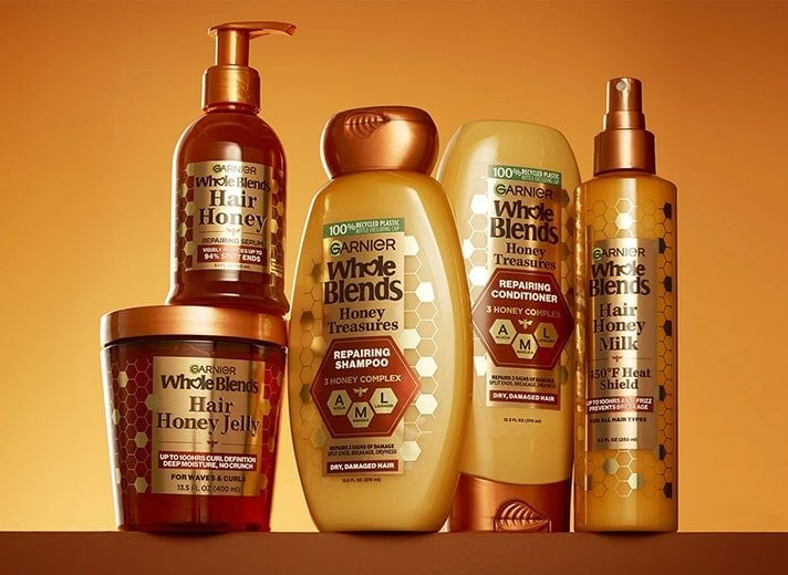 Repair damaged hair with the nourishing Garnier Whole Blends Honey Treasures shampoo, conditioner, and hair mask enriched with honey extracts.
