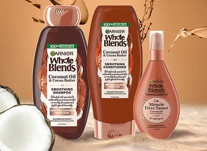 Combat frizz and humidity with the Garnier Whole Blends Coconut Oil and Cocoa Butter shampoo, conditioner, and hair mask enriched with coconut oil and cocoa butter.
