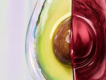 Avocado with oils and red dye drips