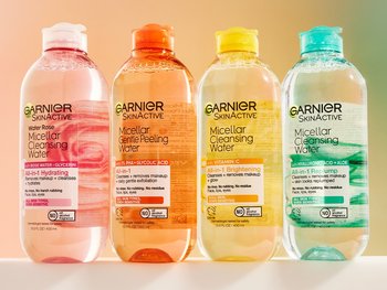 4 Garnier micellar bottles against a watercolor background