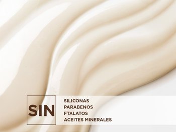 A close-up image of a creamy, light beige product texture with gentle waves. Overlayed on the lower left is a large "NO" symbol, indicating the product is free from "SILICONES," "PARABENS," "PHTHALATES," and "MINERAL OILS."
