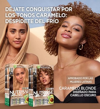 Garnier Ultra Color banner with a woman with long, straight blonde hair beside a woman with curly reddish-brown hair, promoting hair color products under the headline "Caramelos Is Calling: Time to Defrost" and two packs from the Caramelo Blonde hair color collection.