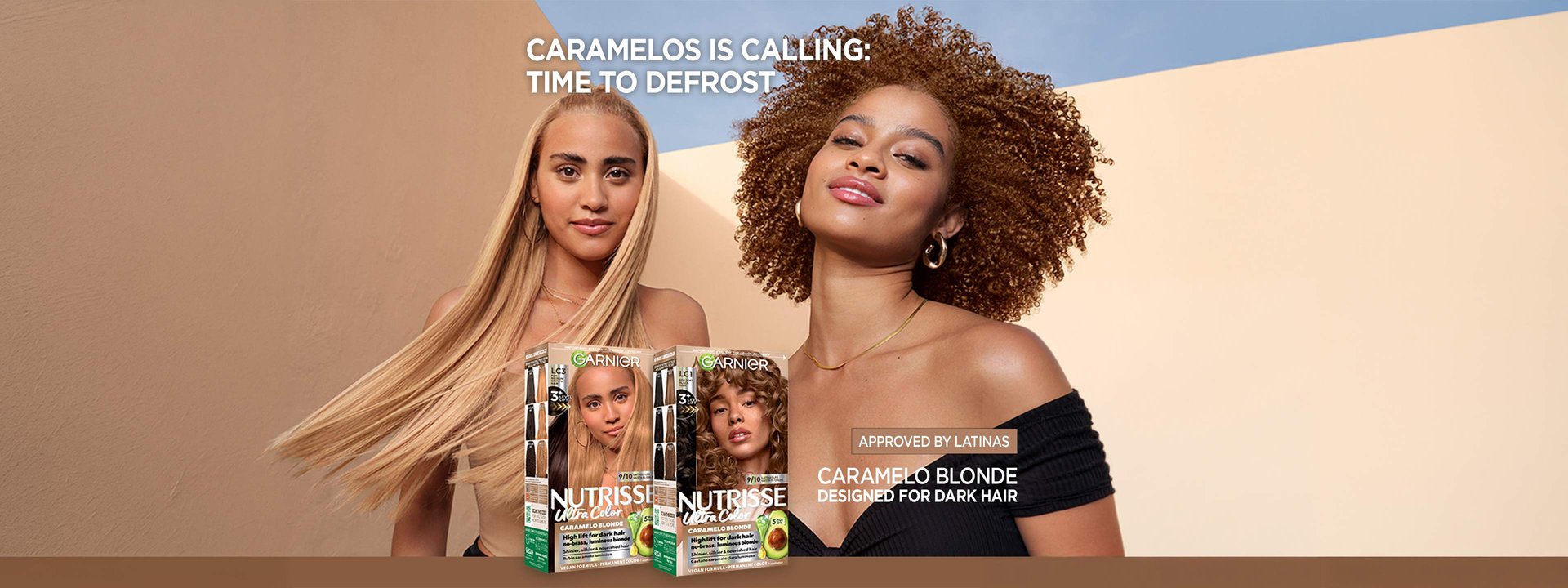 Garnier Ultra Color banner with a woman with long, straight blonde hair beside a woman with curly reddish-brown hair, promoting hair color products under the headline "Caramelos Is Calling: Time to Defrost" and two packs from the Caramelo Blonde hair color collection.