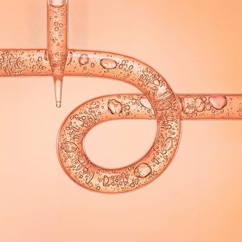 Texture of gel cream liquid Glycolic Acid gel on orange background