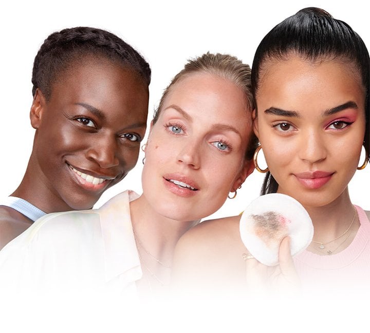 Diverse group of women demonstrating makeup removal results using Garnier Micellar Cleansing Water: showing a used cotton pad with makeup residue to highlight deep cleansing for sensitive skin.