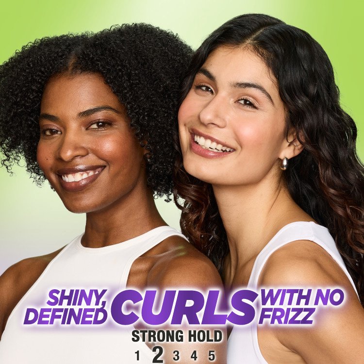Two women with shiny, defined, frizz-free curls.