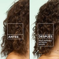 Before and after comparison: frizzy hair transformed into defined curls with no weighdown using Garnier Fructis Curl Construct Creation Mousse.