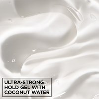 Macro texture shot of clear, smooth Garnier Fructis Curl Control Scrunching Gel with ultra-strong hold and hydrating coconut water.