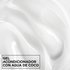 Macro texture shot of smooth, white Garnier Fructis Curl Shine Conditioning Jelly infused with coconut water for intense hair hydration.
