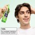 Styling tip for curly hair: man demonstrating the use of Garnier Fructis Curl Shape Defining Spray Gel by spraying once per section for buildable definition.