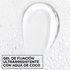 Macro texture shot of clear Garnier Fructis Curl Shape Defining Spray Gel with ultra-strong hold and moisturizing coconut water.