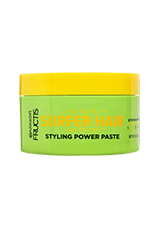 A horizontal view of the Garnier Fructis Surfer Hair Styling Power Paste tub, which is bright lime green with a vibrant yellow lid.