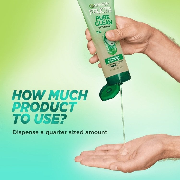 A bottle of Garnier Fructis Pure Clean Styling gel with product being dispensed on to someone's hand. Dispense a quarter sized amount of product for usage.
