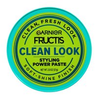 An upward visual of the product packaging of the Garnier Fructis Pure Clean Finishing Paste. Get up to 24 hours of definition with the Pure Clean Finishing Paste, infused with aloe extract.