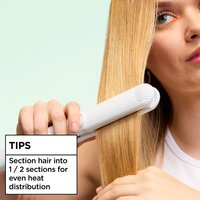 Achieve even heat distribution when using the Garnier Sleek & Smooth Flat Iron Perfector Straightening Mist if you section your hair into half sections.