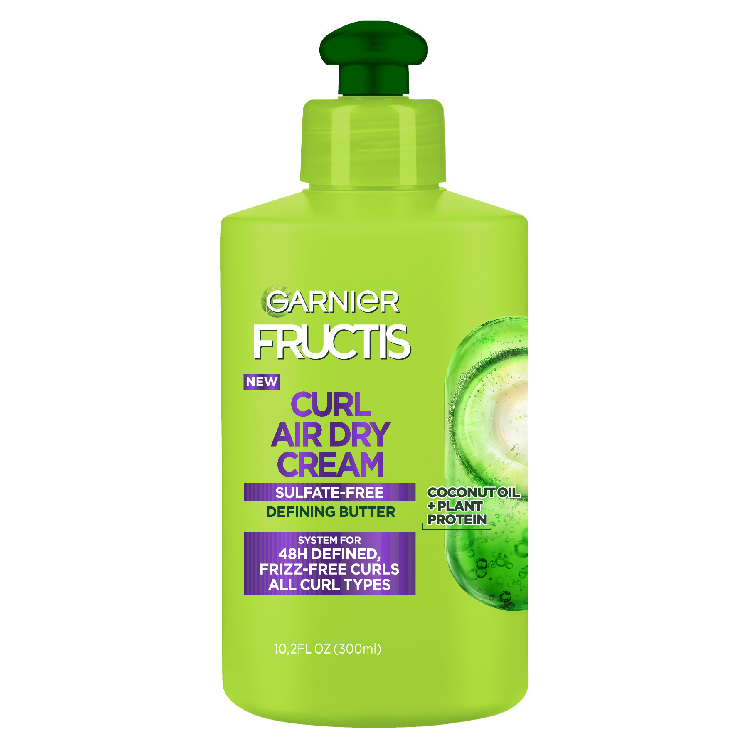 Front of a Garnier Fructis Curl Air Dry Cream bottle (Sulfate-Free Defining Butter) with "Vegan Protein + Coconut Oil" and a claim of "UP TO 48HR DEFINED FRIZZ-FREE CURLS FOR ALL CURL TYPES."