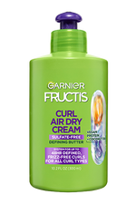 Front of a Garnier Fructis Curl Air Dry Cream bottle (Sulfate-Free Defining Butter) with "Vegan Protein + Coconut Oil" and a claim of "UP TO 48HR DEFINED FRIZZ-FREE CURLS FOR ALL CURL TYPES."