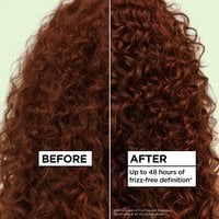 A split image showing "BEFORE" (frizzier, less defined curly hair) and "AFTER" (more defined, frizz-free curly hair) results. The text highlights "Up to 48 hours of frizz-free definition*"