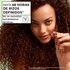 Defined curly hair results with Garnier Fructis: woman demonstrating up to 48 hours of definition without heat tools using the Curl Nourish hair care system.