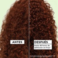 Before and after hair repair results on red curly hair: visibly showing up to 48 hours of frizz-free definition using the Garnier Fructis Curl Nourish hair care system.