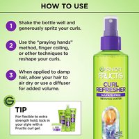 A "How to Use" infographic beside the Garnier Fructis Curl Refresher bottle outlines three steps: shake and spritz curls, use finger-coiling techniques to reshape curls, and air dry or diffuse for volume.