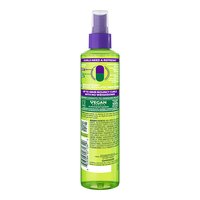The back label of Garnier Fructis Curl Refresher lists vegan, sulfate-free formula details, usage directions, and a full ingredient list on the green spray bottle.