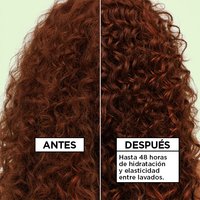 Before and after comparison of frizzy versus defined, glossy curls shows Garnier Fructis Curl Refresher delivering "up to 48 hours of moisture & bounce between washes."